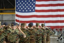 932nd Airlift Wing salutes the American flag during the change of command for incoming commander, Colonel John Flournoy, Jr.  Photo/Tech Sgt. Chris Parr
