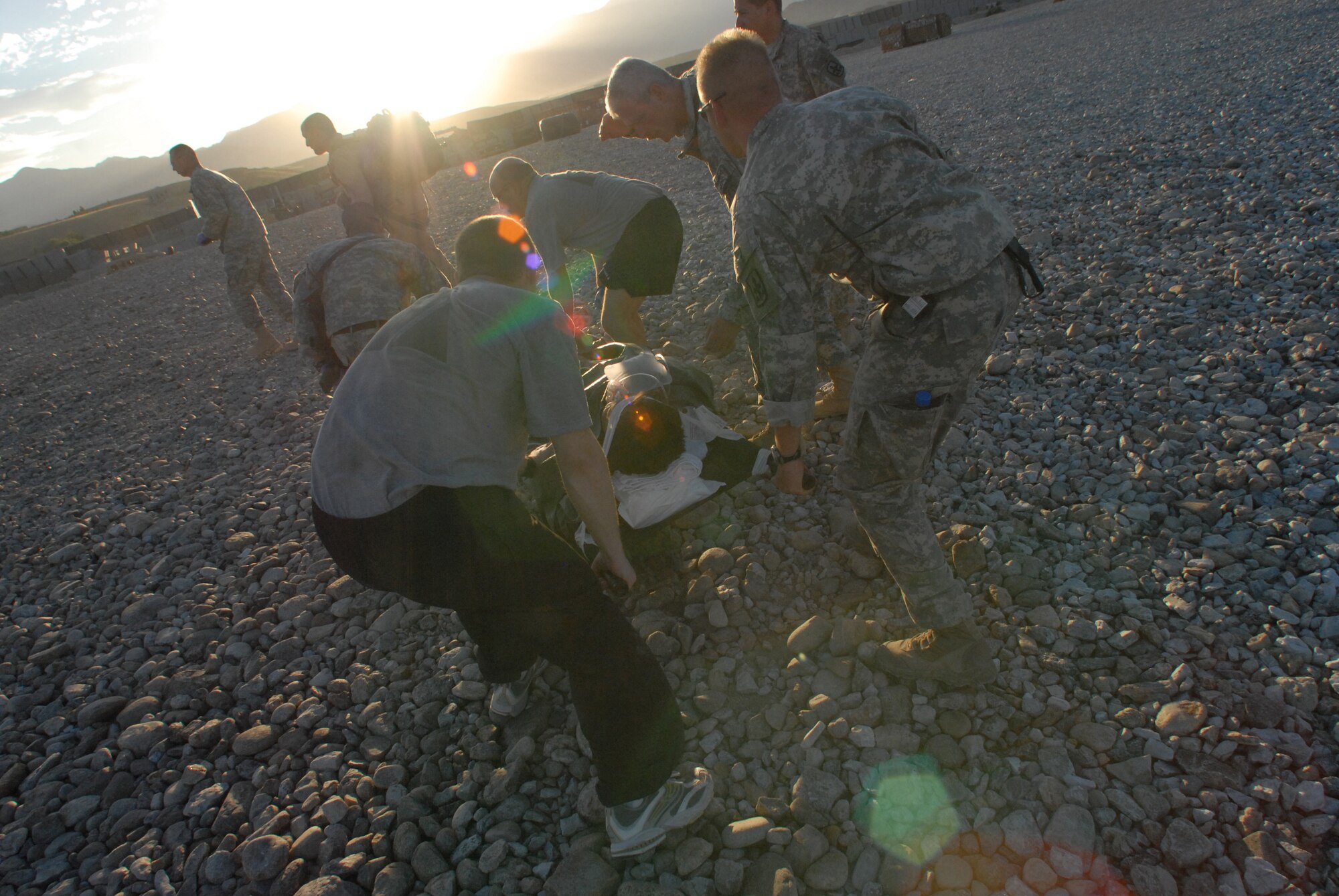 An injured Soldier is transported by Army personnel following a medical evacuation mission in Afghanistan recently. Evacuation missions via helicopter are termed "Dustoff" due to the debris and dirt that end up covering medical technicians due to the helo's rotors. (U.S. Air Force Photo by Tech. Sgt. David Peacock)