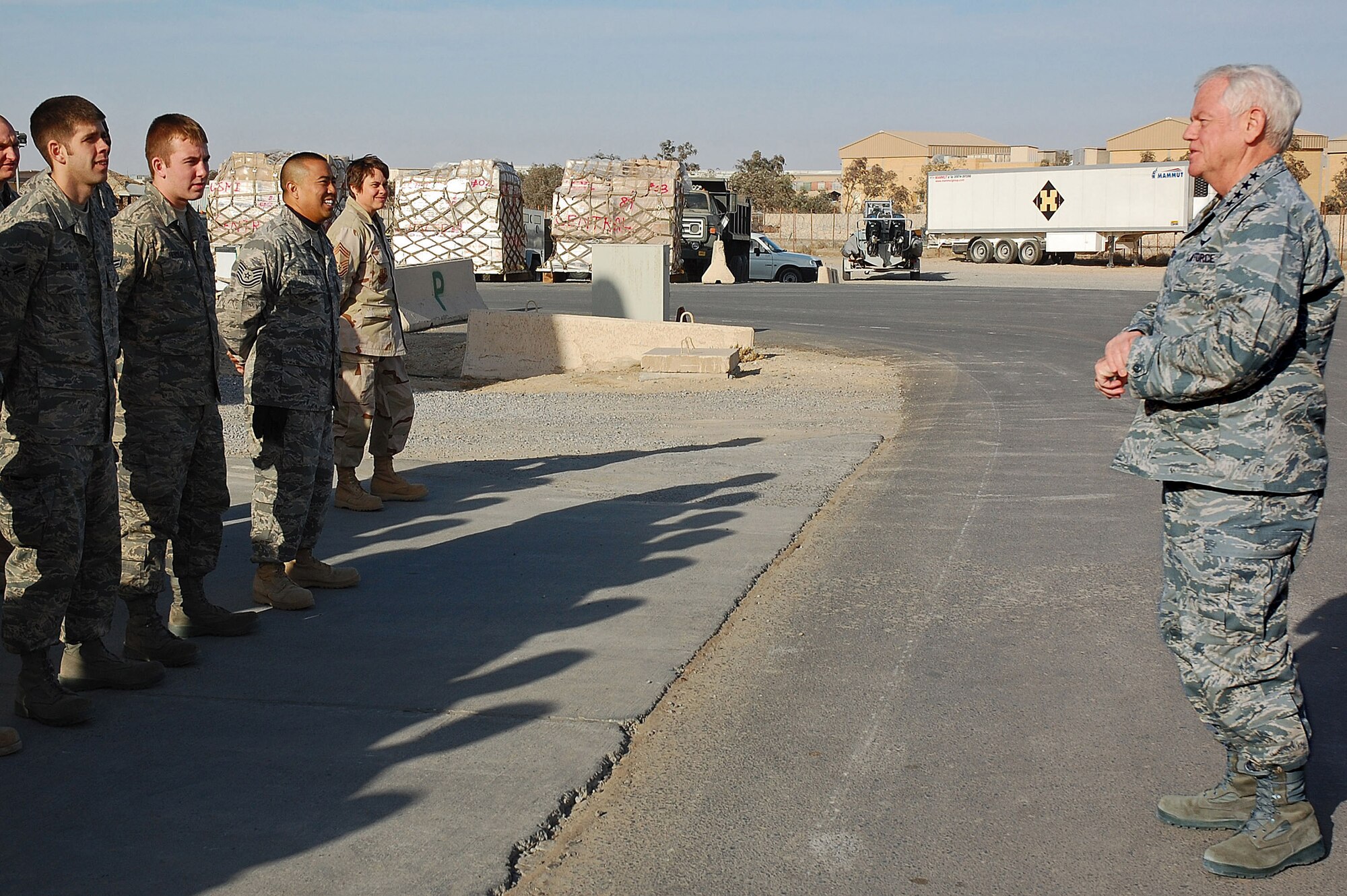 Gen. Arthur J. Lichte visits members of the 386th Expeditionary Logistics Readiness Squadron Aerial Port Flight Jan. 7 at a Southwest Asia air base. General Lichte, commander of Air Mobility Command, was making his first visit downrange since taking command in September. (U.S. Air Force photo/Staff Sgt. Tia Schroeder) 

