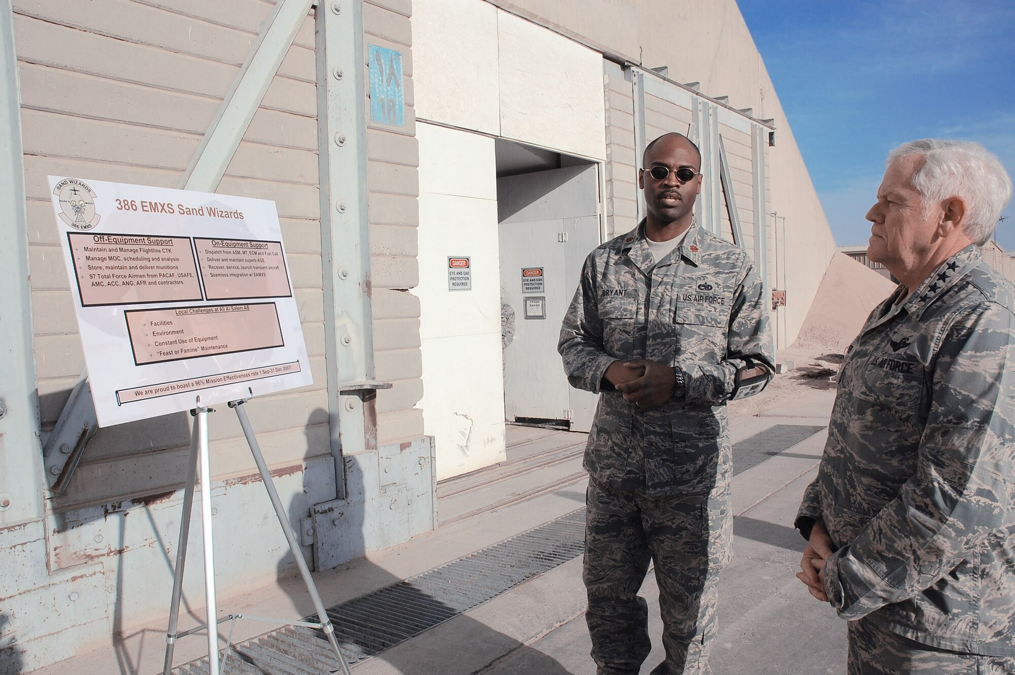 Gen. Arthur J. Lichte receives a mission brief from Maj. Emille Bryant Jan. 7 at a Southwest Asia air base. General Lichte, commander of Air Mobility Command, was making his first visit downrange since taking command in September. Major Bryant is the 386th Expeditionary Maintenance Squadron commander. (U.S. Air Force photo/Staff Sgt. Tia Schroeder) 
