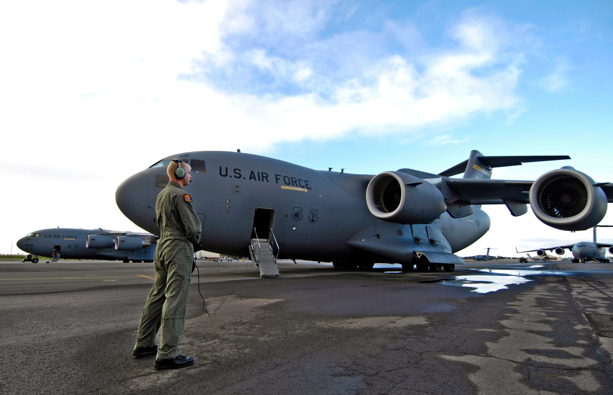 Staff Sgt. John Eller conducts pre-flights check on his C-17 Globemaster III Jan. 3 prior to taking off from Hickam Air Force Base, Hawaii for a local area training mission. Sgt. Eller is a loadmaster from the 535th Airlift Squadron. (U.S. Air Force photo/Tech. Sgt. Shane A. Cuomo) 