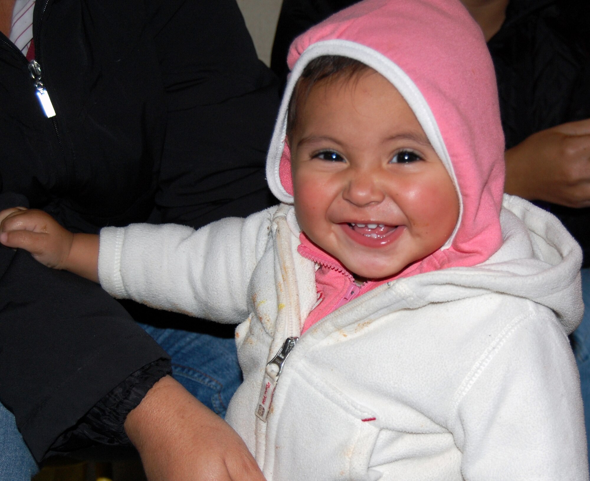 LAUGHLIN AIR FORCE BASE, Texas –A young girl in the Casa de Hogar Manantial de Amor Orphanage, Ciudad Acuña, Mexico smiles during a recent visit from a couple Laughlin members and a  group from Ruben Chavira Elementary School recently. The trip to the orphanage was to try and help less fortunate children receive gifts and good company during the Holiday Season.(U.S. Air Force photo by Airman 1st Class Sara Csurilla)

