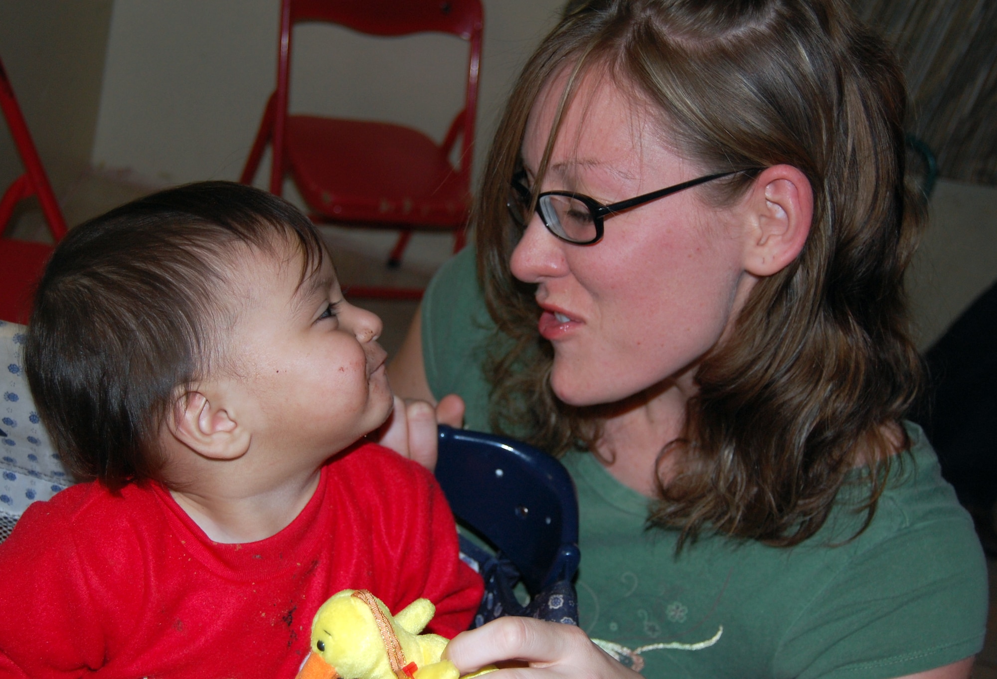 LAUGHLIN AIR FORCE BASE, Texas – Airman 1st Class Nichole Boardman, 47th Comptroller Squadron, becomes acquainted with children from Casa de Hogar Manantial de Amor Orphanage, Ciudad Acuña, Mexico during a recent visit from a couple Laughlin members and a  group from Ruben Chavira Elementary School.(U.S. Air Force photo by Airman 1st Class Sara Csurilla)


