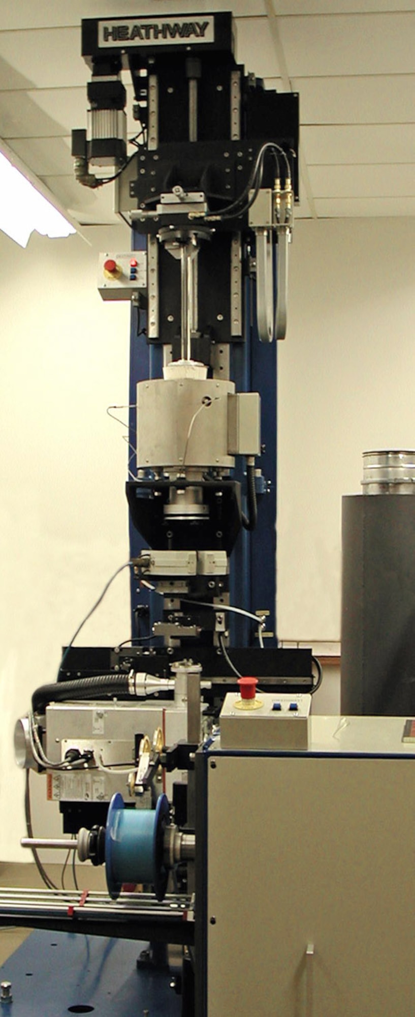 This glass fiber drawing tower can reduce the size of fibers from approximately one-half inch in diameter to smaller than a human hair. (Courtesy photo)