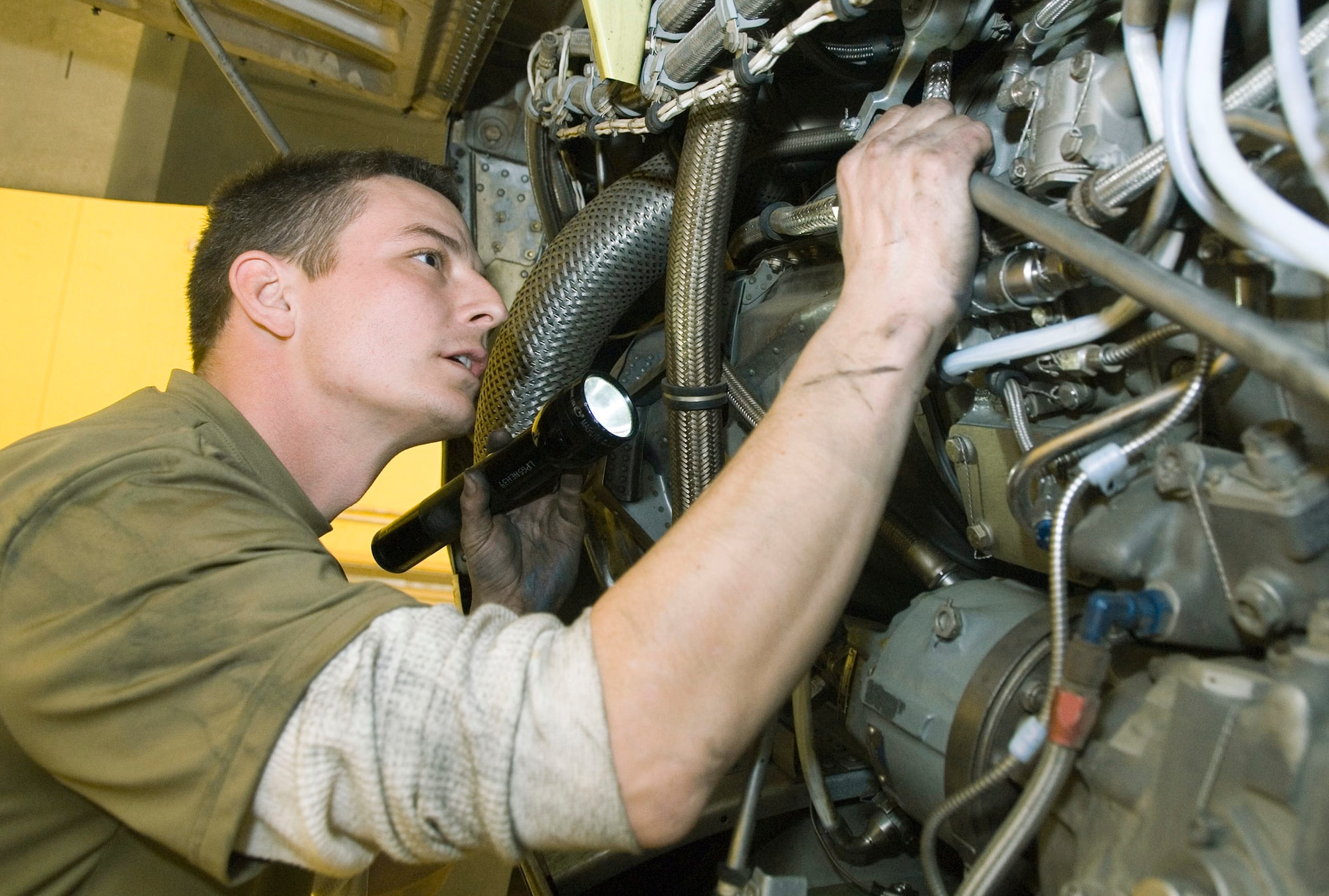 Senior Airman Wes Leturgez performs a rig test on a C-130 Hercules engine Jan. 4 at Balad Air Base, Iraq. The rigging of the aircraft controls all propeller systems in the engine compartment. Airman Leturgez is an aircraft maintenance unit crew chief for the 777th Expeditionary Airlift Squadron and is deployed from Little Rock Air Force Base, Ark. (Air Force photo/Staff Sgt. Joshua Garcia) 