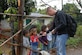 EL VOLCAN, Honduras - Army Warrant Officer Benjamin Martin, a pilot with the 1st Battalion, 228th Aviation Regiment, hands toys to local children during a hike to El Volcan planned by the Joint Task Force-Bravo chapel Jan. 5.  The seven-mile hike was the last of a series of five in which JTF-Bravo servicemembers delivered food to local villagers.  Participants in the hike to El Volcan carried toys for local children with them because the hike happened one day before Three Kings Day, a holiday which Hondurans traditionally celebrate by giving gifts to children. (Air Force photo by 1st Lt. Erika Yepsen/Joint Task Force-Bravo Public Affairs)