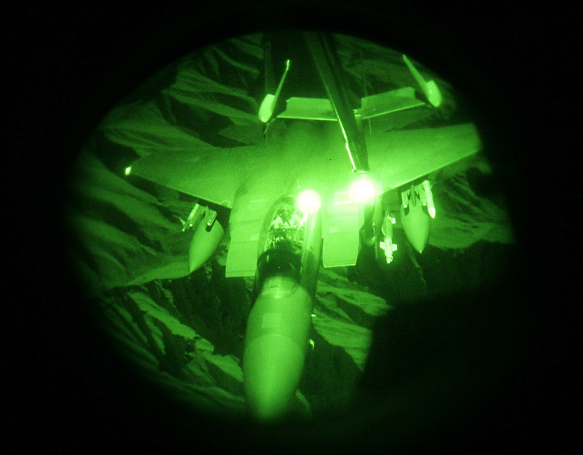 A KC-10 from the 908th Expeditionary Air Refueling Squadron refuels an F-15 December 27, 2007.  The crew was Capt. Fred Luck, aircraft commander, Capt. Dennis Abramonwicz, co-pilot, Tech. Sgt. Ben Hopp, and Staff Sgt. Jeremy Pratt.  They are all deployed from Travis AFB, Calif. The crew off-loaded 126,000 pounds of fuel and on-loaded 40,000 pounds of fuel. The flights occured at night over Afghanistan.
