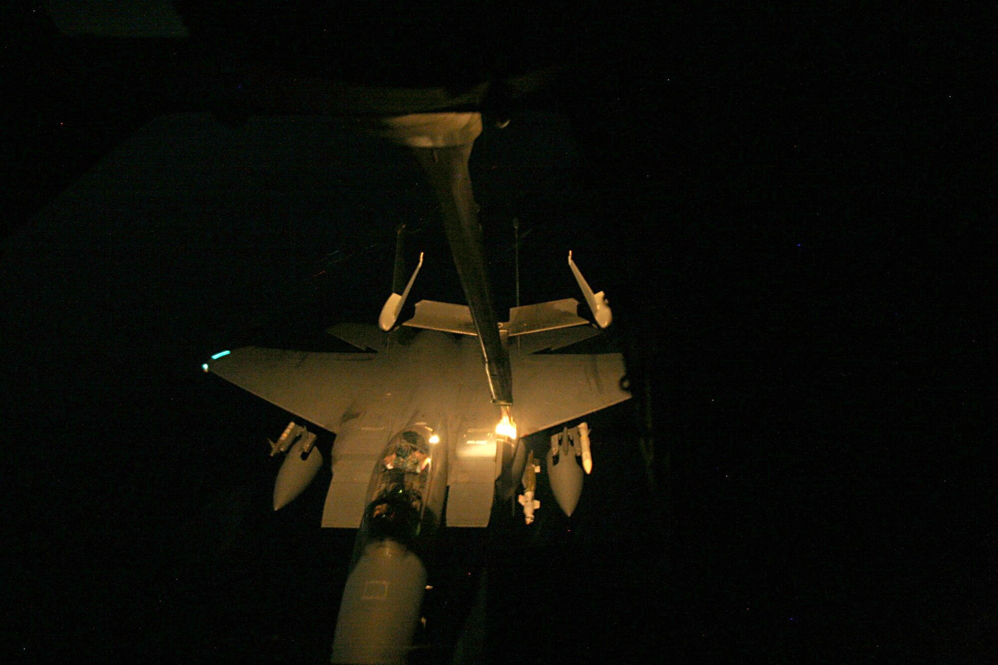 A KC-10 from the 908th Expeditionary Air Refueling Squadron refuels an F-15 December 27, 2007.  The crew was Capt. Fred Luck, aircraft commander, Capt. Dennis Abramonwicz, co-pilot, Tech. Sgt. Ben Hopp, and Staff Sgt. Jeremy Pratt.  They are all deployed from Travis AFB, Calif. The crew off-loaded 126,000 pounds of fuel and on-loaded 40,000 pounds of fuel. The flights occured at night over Afghanistan.
