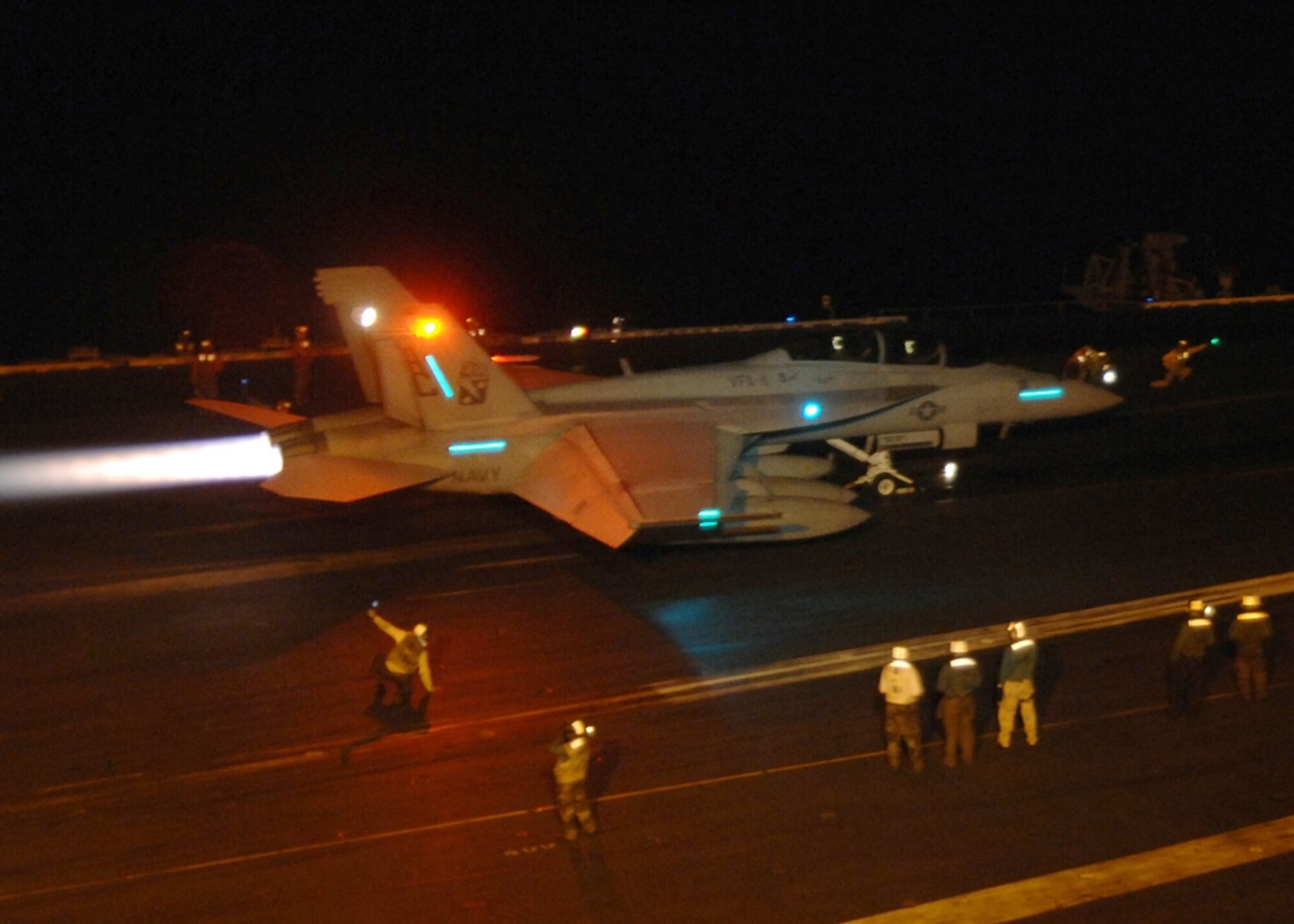 ARABIAN GULF - An F/A-18F Super Hornet attached to Strike Fighter Squadron 11, the "Red Rippers," prepares to launch flight deck of aircraft carrier USS Harry S Truman during night flight operations.  Truman and embarked Carrier Air Wing 3 are underway on a deployment in support of Operations Enduring and Iraqi Freedom.  (U.S. Navy photo by Seaman Kevin T. Murray, Jr., Released)