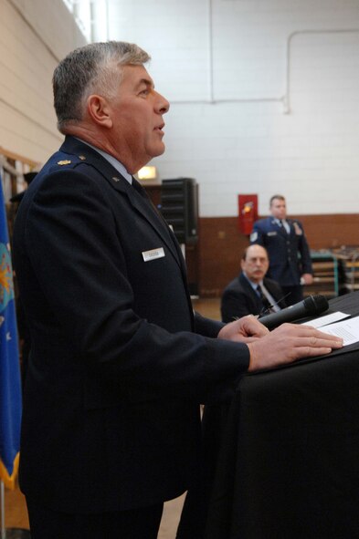 SHAW AIR FORCE BASE, S.C. -- Maj. William Cassida, Defense Attache from the U.S. Embassy in France, speaks before presenting the watch of fallen bomber pilot Capt. Donald Cole to his son, Donald Cole Walters, at the Asheville, N.C. National Guard Armory Dec 28. Capt. Cole stayed at the controls of his wounded B-17 that caught ablaze after being hit by German antiaircraft fire so that his nine fellow crewmembers could parachute to safety. He then steered the plane away from the French village of Nieul-les-Saintes, crashing it half a mile away Jan. 5, 1944. (U.S. Air Force photo/A1C Kathrine McDowell)