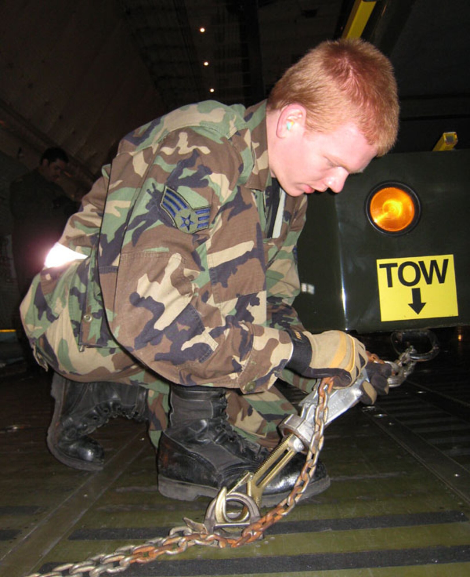 Air Force Reservist Senior Airman Benjamin Gunter trains on properly tying down rolling stock cargo…just a portion of the 84,000 pounds of rolling stock loaded during a recent exercise conducted by the 72nd Aerial Port Squadron, 507th Air Refueling Wing.