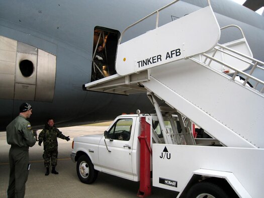 Members of the 72nd Aerial Port Squadron, 507th Air Refueling Wing, Air Force Reserve Command, practice maneuvering a staircase truck to the C-5 Galaxy parked on the ramp at Tinker AFB, Oklahoma, to train on procedures for safe loading and unloading of passengers.
