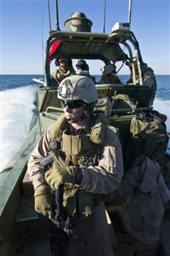 U.S. Navy sailors from Riverine Squadron 2 conduct a security patrol on Lake Qadisiyah near Haditha Dam, Iraq, on Dec. 28, 2007.  The sailors from Detachment 3 of the squadron regularly patrol the lake and the surrounding inland waterways, protecting their use for legitimate water borne commerce.  