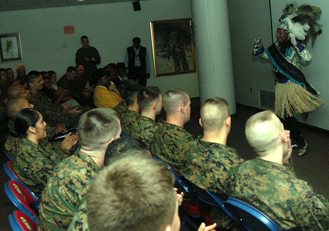 Larry Roy, Zulu Minister of Fun, performs during a presentation Jan. 7. The Zulu Social Aid and Pleasure Club visited MarForRes, giving Marines insight into Mardi Gras history and culture.