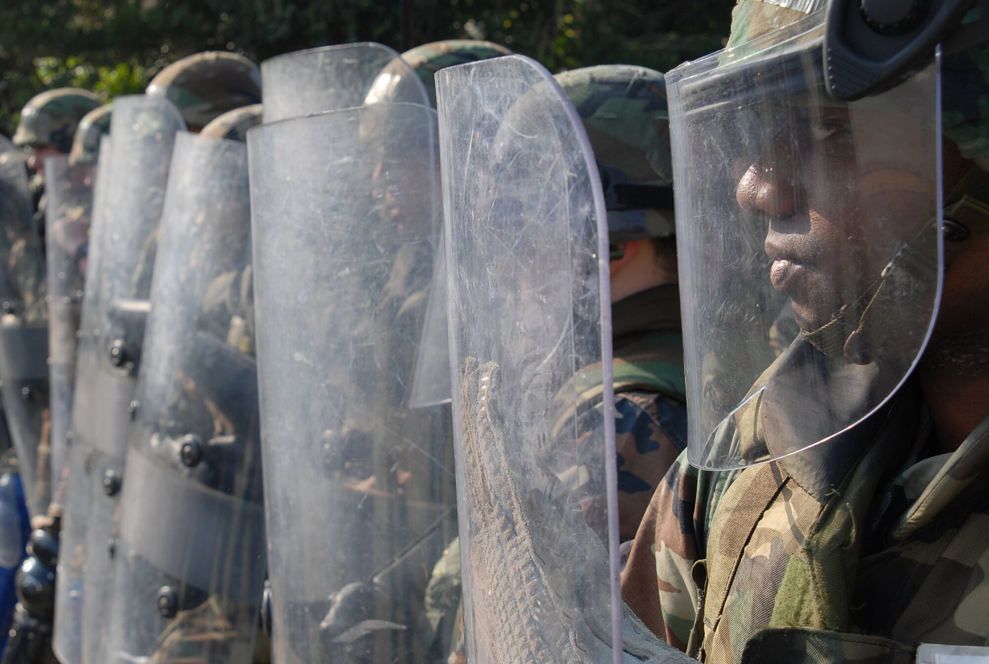 Members of the 18th Security Forces Squadron Confrontation Management Team respond to a simulated protest during Local Operational Readiness Exercise Beverly High 08-3 at Kadena Air Base, Japan, Jan. 7, 2007. The 18th Wing conducted the exercise from Jan. 7 to 11 to test Airmen's ability to respond in contingency situations. (U.S. Air Force photo/Tech. Sgt. Dave DeRemer)