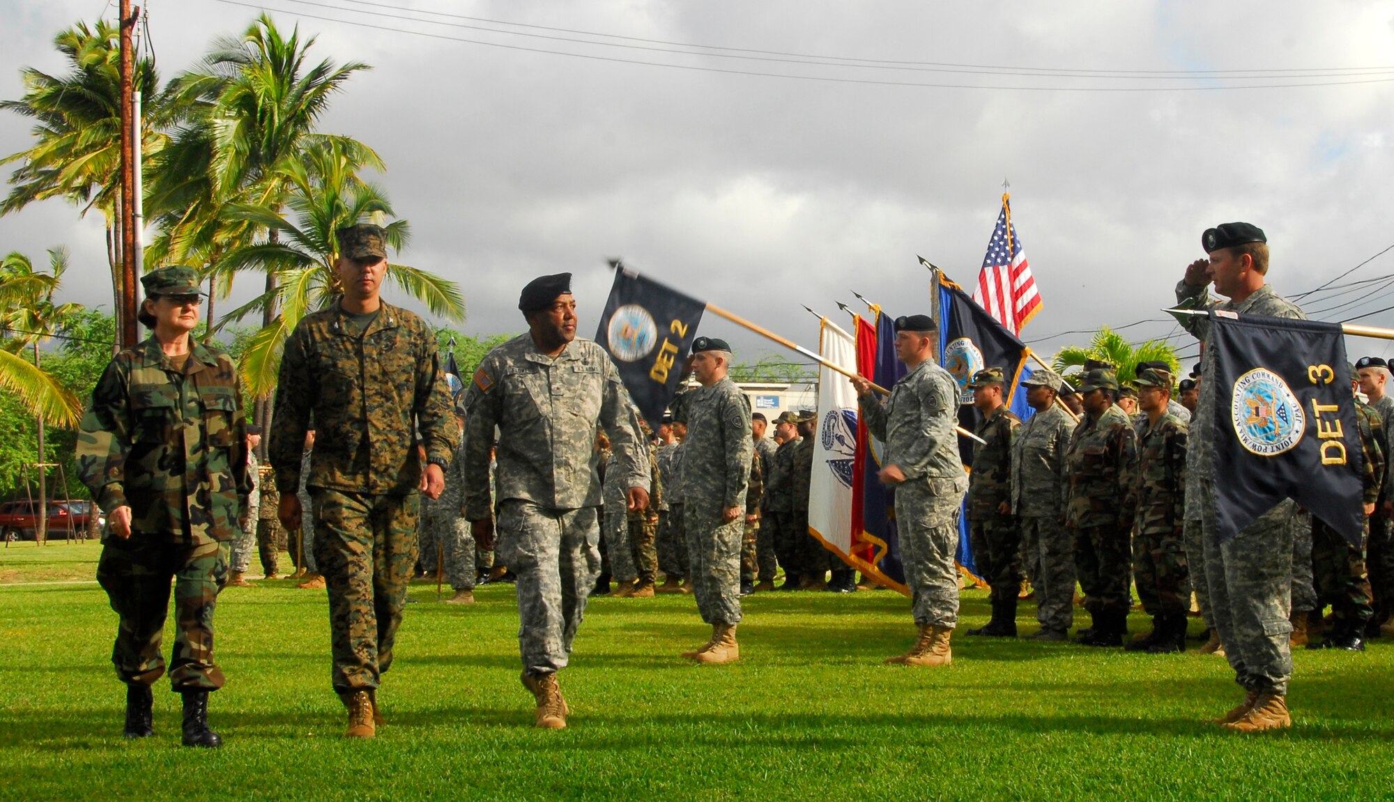 Rear Admiral Donna L. Crisp, Colonel John Hahn and Brigadier General Michael Flowers perform a pass and review during a Change of Command Ceremony for the Joint POW/MIA Accounting Command on January 4, 2008, Hickam A.F.B., Hawaii.  (U.S. Air Force Photo by Staff Sgt. Bradley C. Church)