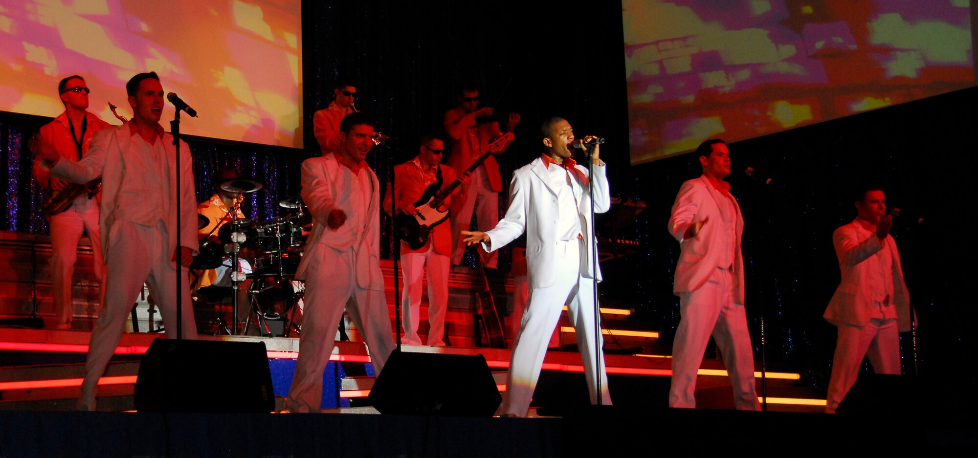 Vocalist Senior Airman Tyrece Robertson sings his heart out during an annual Tops in Blue visit to Andersen on Jan. 3. Airman Robertson is one of ten Tops in Blue vocalists who travel with the Tops in Blue band to nearly 100 locations each year, performing for nearly 250,000 military members and dependents. (U.S. Air Force photo/Airman 1st Class Jonathan Hart)