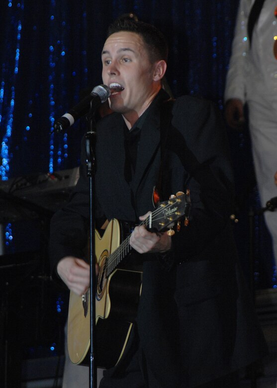 Senior Airman Benjamin performs a hit song by Johnny Cash for an audience full of service members and their families here Jan. 3. Tops In Blue 2007 is a musical salute to the courageous men and women who have served in the U.S. Air Force since it became a seperate service 60 years ago. (U.S. Air Force photo/Senior Airman Sonya Padilla)