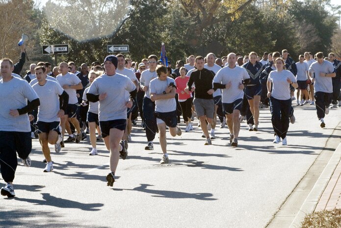 Team Charleston members participate in the bi-monthly Commander's Fitness Challenge Run Jan. 4.  Tech. Sgt. Mike Bunting, 315th Maintenance Squadron, was the fastest male runner with a finish time of 16:16 minutes, and Capt. Kathryn Miller, 437th Airlift Wing Legal Office, was the fastest female with a finish time of 22:05 minutes.  The largest formation running award went to the 437th Communications Squadron. (U.S. Air Force photo/Staff Sgt. Jennifer Arredondo) 