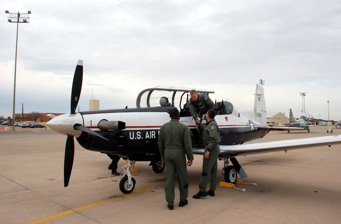 Col. David Petersen, 80th Flying Training Wing commander, is greeted by Lt. Col. Andrew Toth, 80th Operations Group deputy commander, and Lt. Col. Ternell Washington, 80th FTW, Jan. 4. Colonel Petersen and Maj. Jeff Grayson, 97th Flying Training Squadron chief of training, traveled to Randolph Air Force Base, Texas, to retrieve the first T-6A Texan II's in Sheppard’s inventory. (U.S. Air Force photo/Airman 1st Class Jacob Corbin)