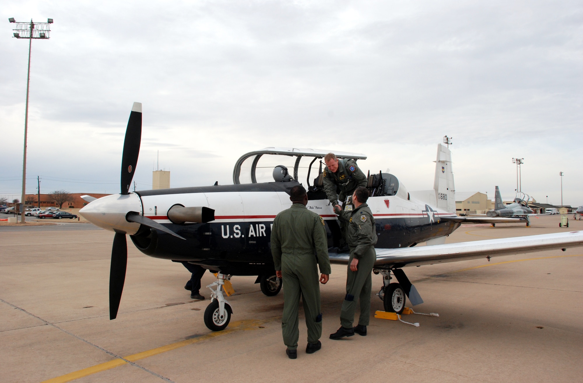Col. David Petersen, 80th Flying Training Wing commander, is greeted by Lt. Col. Andrew Toth, 80th Operations Group deputy commander, and Lt. Col. Ternell Washington, 80th FTW, Jan. 4. Colonel Petersen and Maj. Jeff Grayson, 97th Flying Training Squadron chief of training, traveled to Randolph Air Force Base, Texas, to retrieve the first T-6A Texan II's in Sheppard’s inventory. (U.S. Air Force photo/Airman 1st Class Jacob Corbin)
