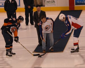 LANGLEY AIR FORCE BASE, Va. -- Col. Brian Yolitz, 1st Mission Support Group commander, performs the ceremonial opening puck drop during the Admirals’ Langley Appreciation Night at the Norfolk Scope Center Jan. 5. More than 80 Airmen attended the event. (U.S. Air Force photo/Airman Basic Rebecca Montez)