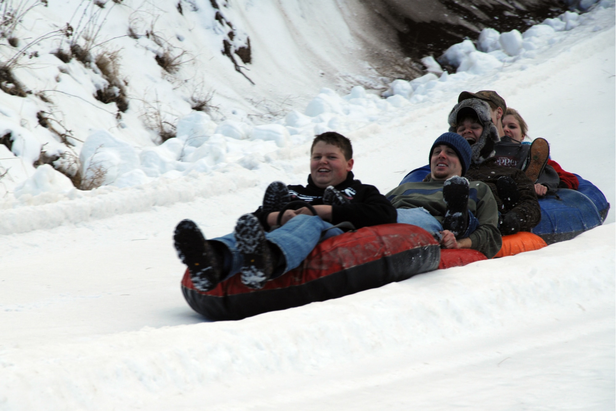 Ruidoso residents take a tube ride downhill at a Ruidoso winter park. Ruidoso and its surrounding areas, also, offer skiing, fishing, horseracing, golfing, biking, hiking and many other activitieis for all interests and tastes. (U.S. Air Force photo/Airman 1st Class Jamal D. Sutter)