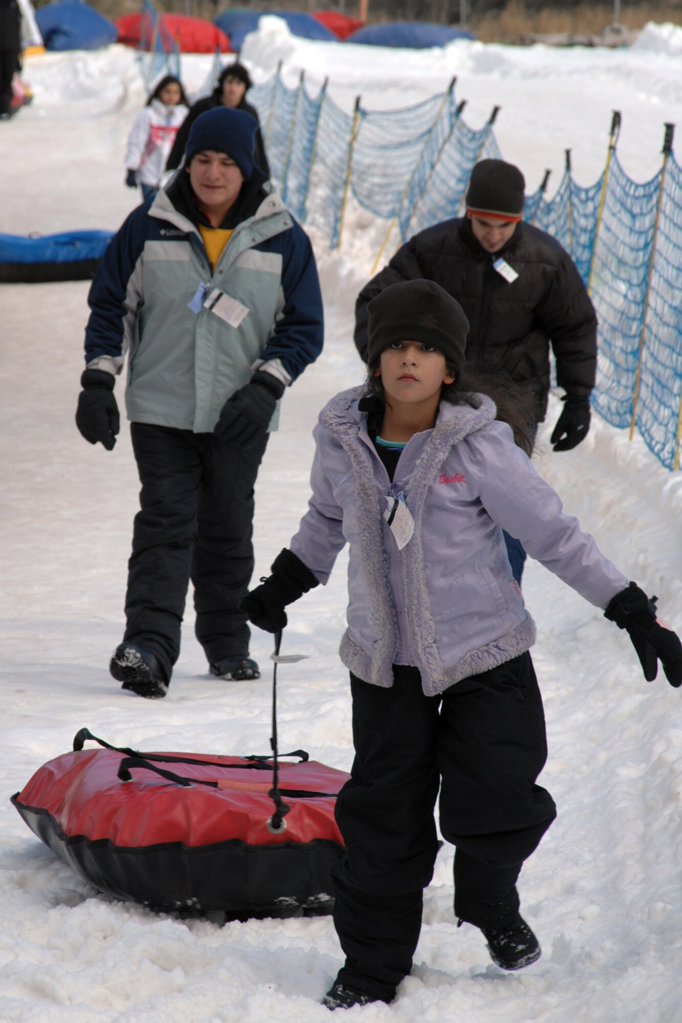 A Ruidoso resident approaches a conveyor that will take her uphill at a Ruidoso winter park. Tubing areas for smaller children are, also, available. (U.S. Air Force photo/Airman 1st Class Jamal D. Sutter)