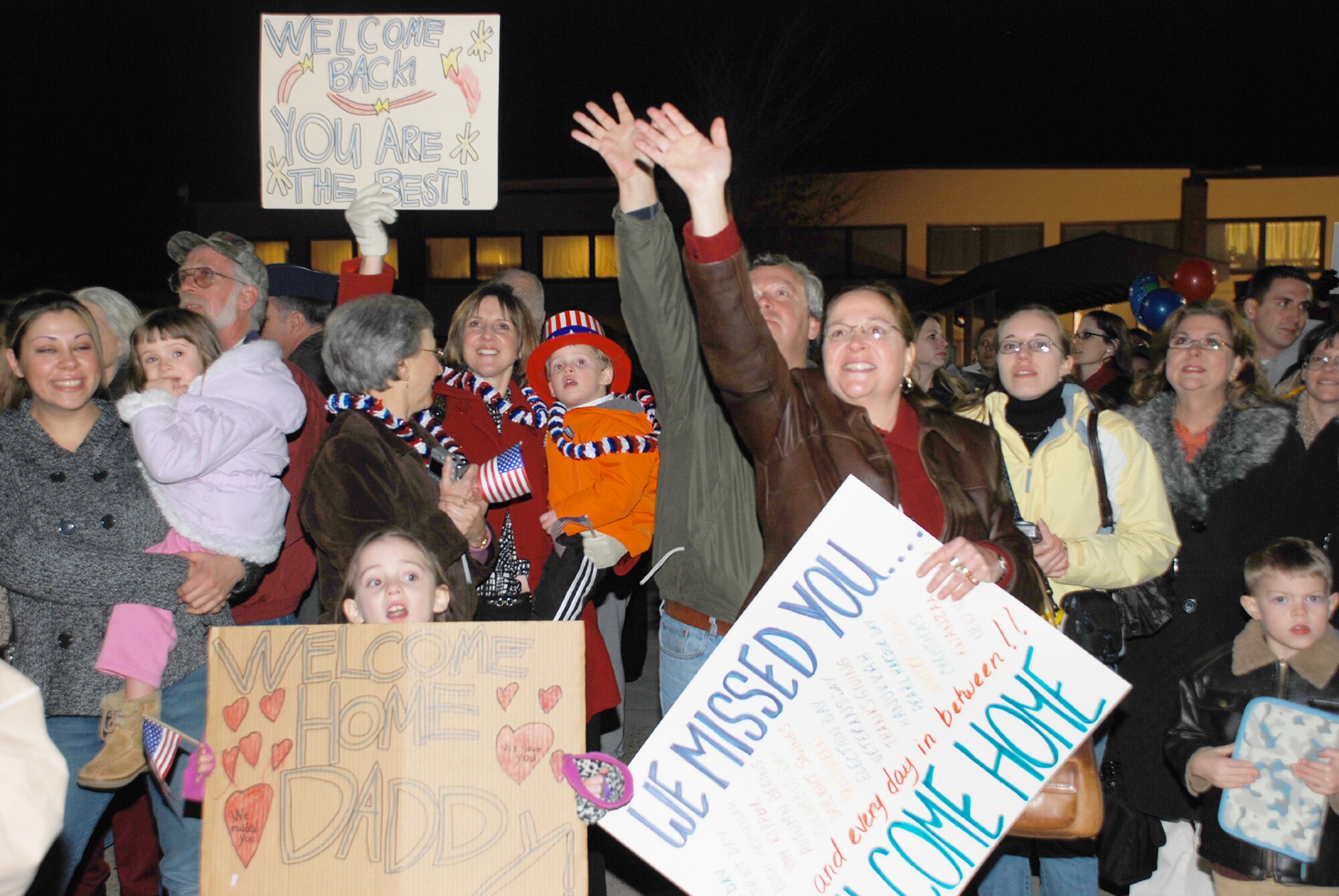 Family members welcome home Airmen of the 6th Airlift Squadron upon their return from deployment in support of Operation Iraqi Freedom and Operation Enduring Freedom. Also deployed with the 6th AS were members from the 305th Operations Group, 305th Mission Support Group and the Air Mobility Command Test and Evaluation Squadron. (U.S. Air Force photo/2nd Lt. Michael Hogg)