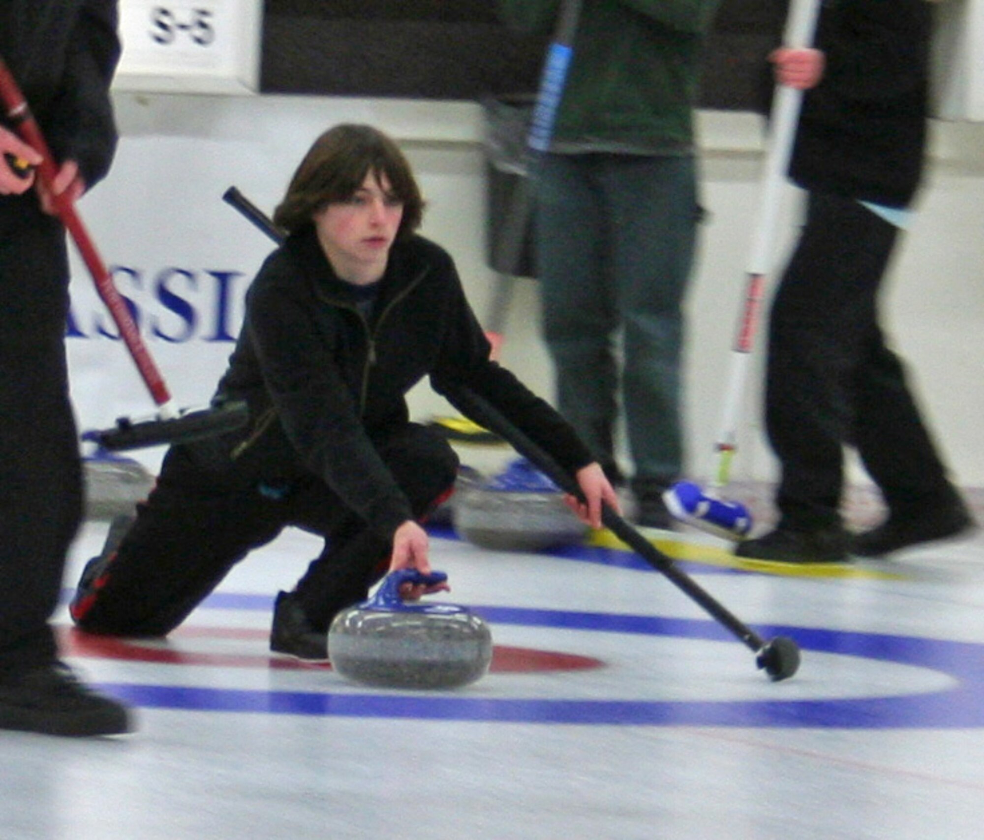EIELSON AIR FORCE BASE, Alaska-- Ryan Flippo, son of Lt. Col. David Flippo, 354th Aircraft Maintenance Squadron commander, makes a shot during a curling event Dec. 30, 2007, at the Fairbanks Curling Club. Ryan competed in late November to be a part of Team Alaska's junior men's league, which will represent Alaska and the United States in the March 2008 Arctic Winter Games against countries from around the world. (U.S. Air Force photo by Lt. Col. David Flippo)