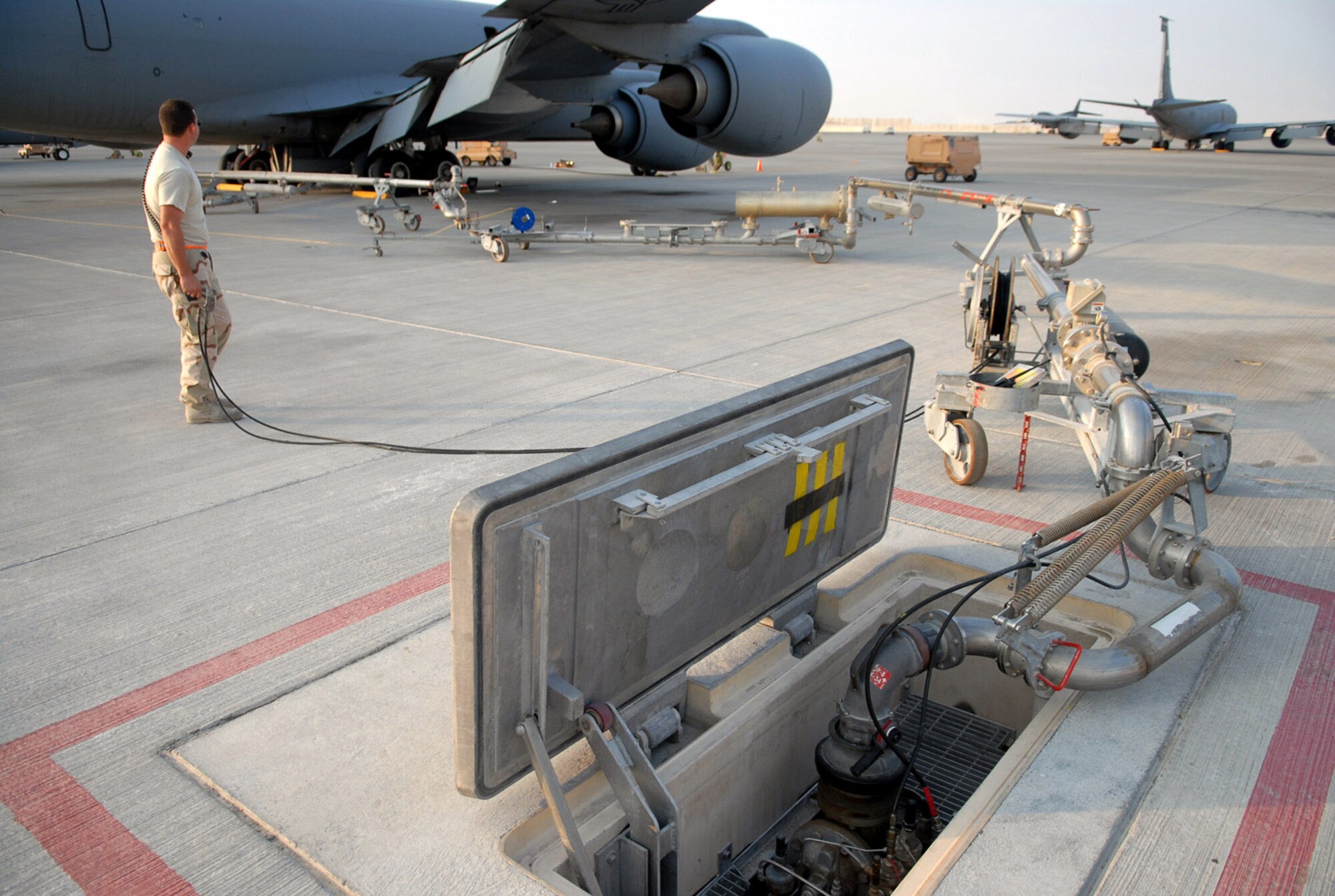 Staff Sgt. Brian McCaslin holds the "dead-man switch" during a refueling operation of a KC-135 Stratotanker Jan. 5 at a Southwest Asia air base. As its name suggests, the switch is a device intended to stop the fuel process in case the human operator becomes incapacitated, and is a form of fail-safe. Sergeant McCaslin is with the 379th Expeditionary Logistics Readiness Squadron and is deployed from the Ebbing Air National Guard, at Fort Smith Ark. His hometown is Springdale, Ark. (U. S. Air Force photo/Staff Sgt. Douglas Olsen)