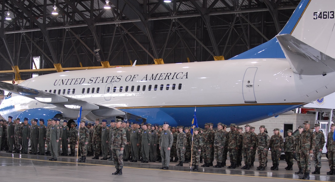 932nd Airlift Wing members stand before the C-40C distinguished visitor airplane inside the hangar at Scott Air Force Base, Ill.  They were waiting the arrival of their new commander Col. John (Jay) C. Flournoy, Jr.  Photo/Tech Sgt. Gerald Sonnenberg