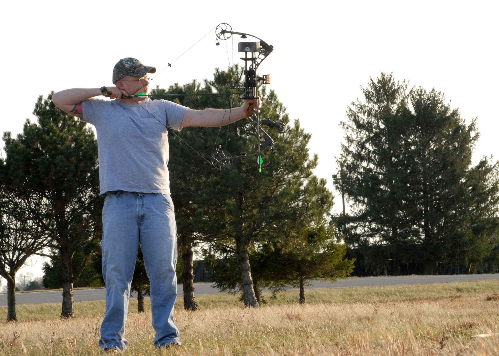 Senior Airman Andrew Pierson, 436th Maintenanace Squadron aero-repair journeyman, fires his compound bow at the Dover Air Force Base archery range Jan. 7. Airman Pierson and many of his friends make frequent use of the new targets on the range, which were purchased by the Dover AFB First Sergeant Council as part of $10,000 the first sergeants used for quality-of-life improvements in 2007. (U.S. Air Force photo/Tech. Sgt. Kevin Wallace)