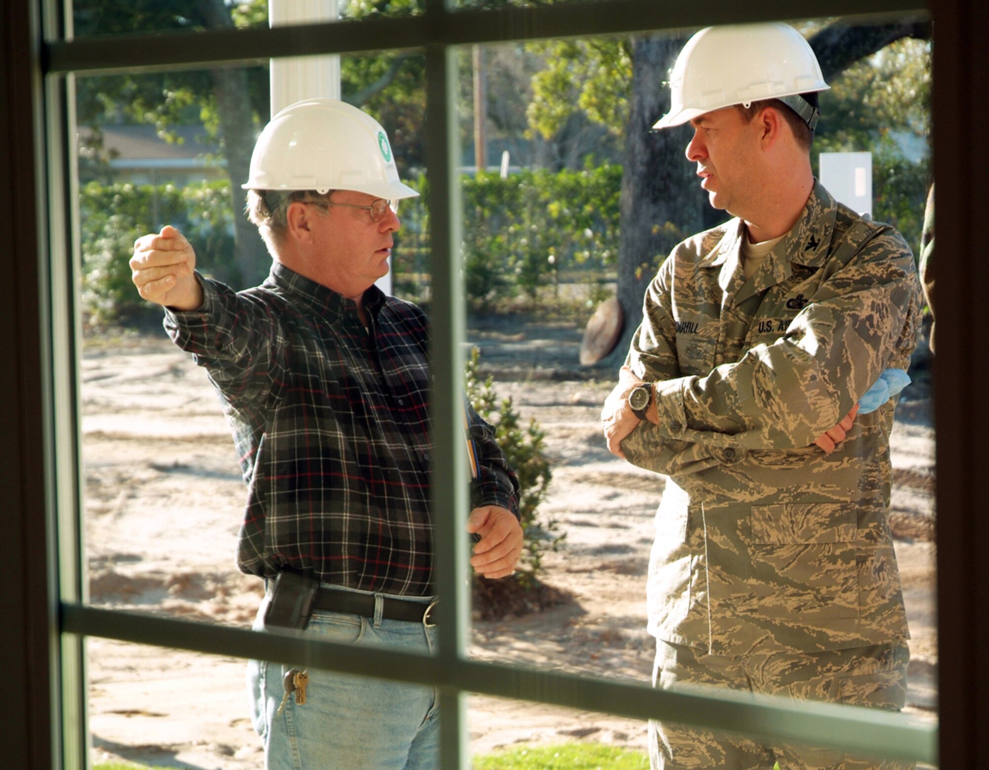 Larry Trafton, left, explains the yard layout for one of the new Thrower Park homes to Colonel Touhill.  Mr. Trafton is the Air Force Center for Environmental Excellence’s onsite project manager.  (U.S. Air Force photo by Adam Bond)