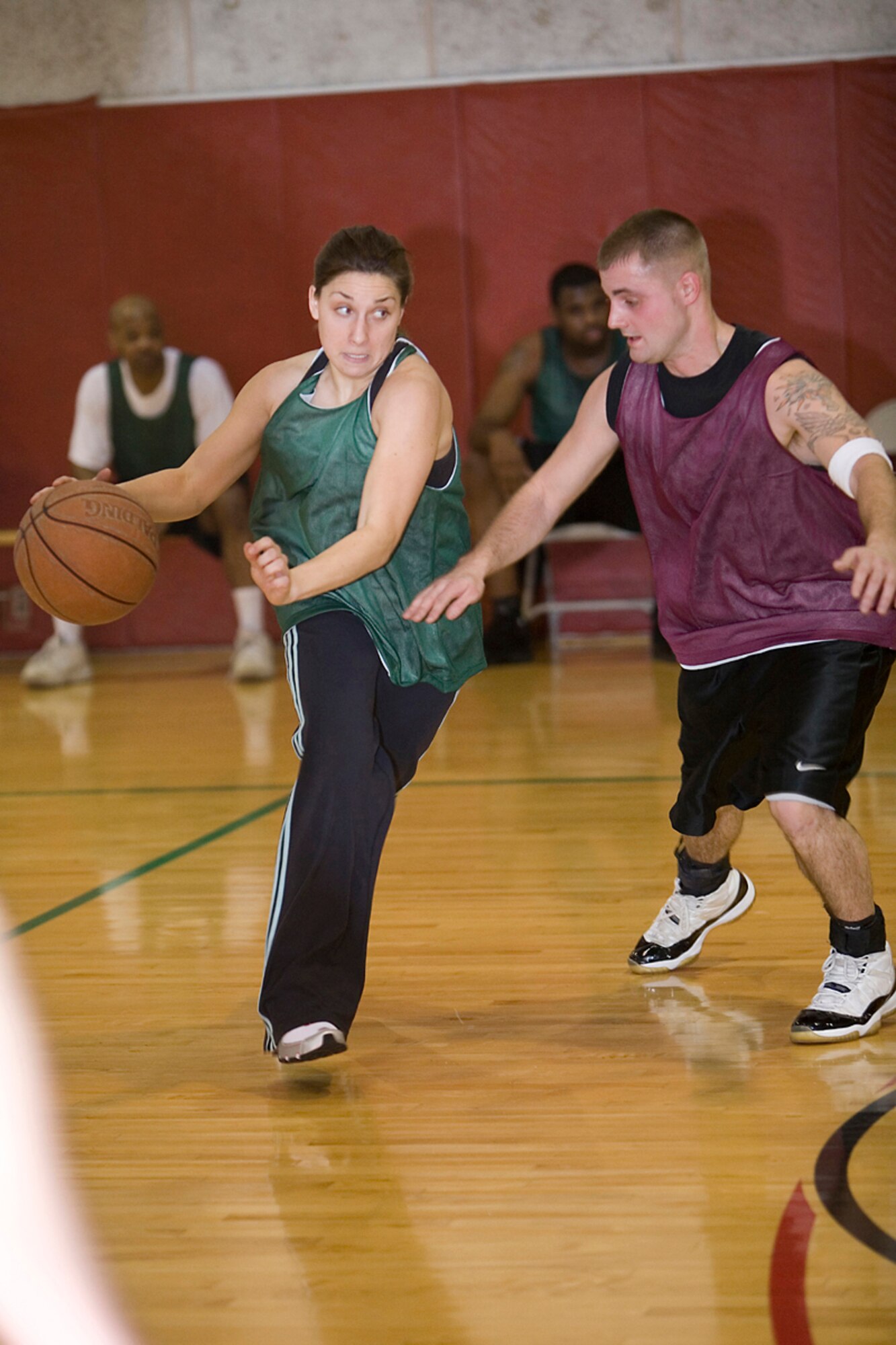 GRISSOM AIR RESERVE BASE, Ind.-- Julie Meisel, left, 434th Security Forces Squadron, is determined to get past Traey Corbin, 434th Services Flight, during the annual 434th Services Flight basketball tournament at Grissom. With strong opposition, SVF managed to speed past the Cops ending an evenly matched game with a 34-29 victory. (U.S. Air Force Photo /Senior Airman Omar Delacruz)
