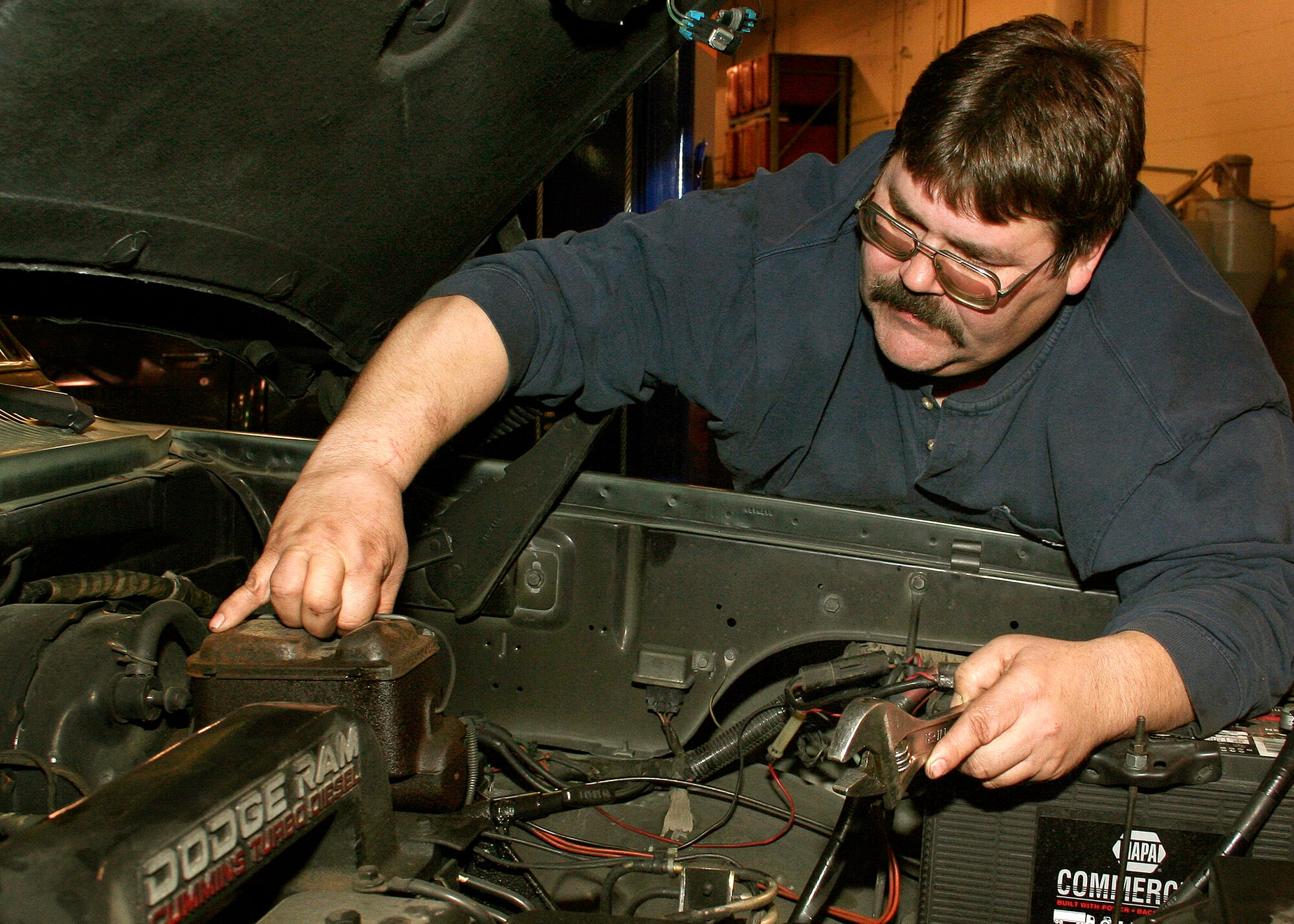 GRISSOM AIR RESERVE BASE, Ind., --  Mike Nero, a vehicle mechanic, checks the brake fluid levels in a truck at the vehicle maintenance facility at the base.  Grissom has a work force that includes military personnel, Department of Defense civilians and contractors.  (U.S. Air Force photo/Tech. Sgt. Patrick M. Kuminecz)