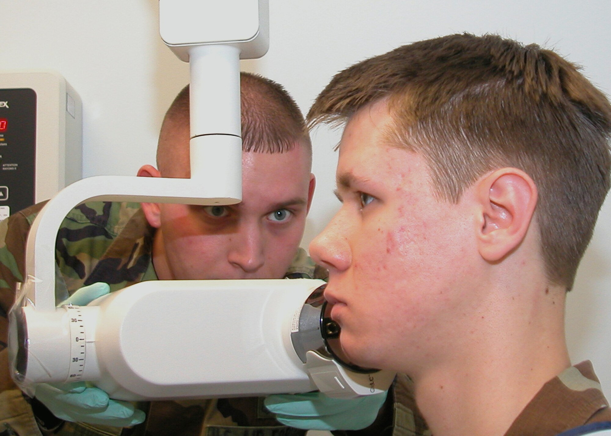 GRISSOM AIR RESERVE BASE, Ind., -- Senior Airman John Dietz a dental technician with the 434th Aerospace Medicine Squadron, left, aligns the dental x-ray scanner on James Hlevyack, 434th Security Forces Squadron, during the January unit training assembly.  A full dental evaluation including x-rays is required during an individual's long physical examination every three years. (U.S. Air Force photo/Senior Airman Chris Bolen)