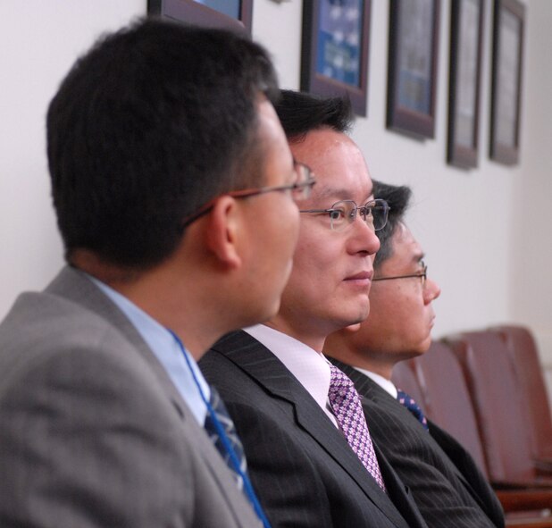 OSAN AIR BASE, South Korea -- Mr. Yi, Kil Yong (left), Mr. Kim, Bong Kon (middle), and Mr. Woo Maeng Yeol (Last) listen to a brief on the history of the 7th Air Force here Jan. 8.  The leadership of 7th Air Force hosted Gunsan civic leaders at Osan Air Base in support of the Good Neighbor Program where Kunsan Air Base is educating local civic leaders on the Air Force, 7th AF and 8th Fighter Wing missions while demonstrating how we work and train with our Korean allies to maintain peace and stability in the region. (U.S. Air Force photo/Senior Airman Steven R. Doty)