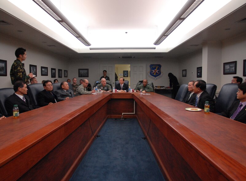 OSAN AIR BASE, South Korea -- Mayor of Gunsan City, Dong Shin Moon (back center), and other Gunsan City leaders meet with Lt. Gen Stephen Wood, 7th Air Force Commander (back left), and Colonel CQ "Wolf" Brown, 8th Fighter Wing commander (back right), here Jan. 8.  The leadership of 7th Air Force hosted Gunsan civic leaders at Osan Air Base in support of the Good Neighbor Program where Kunsan Air Base is educating local civic leaders on the Air Force, 7th AF and 8th Fighter Wing missions while demonstrating how we work and train with our Korean allies to maintain peace and stability in the region. (U.S. Air Force photo/Senior Airman Steven R. Doty)