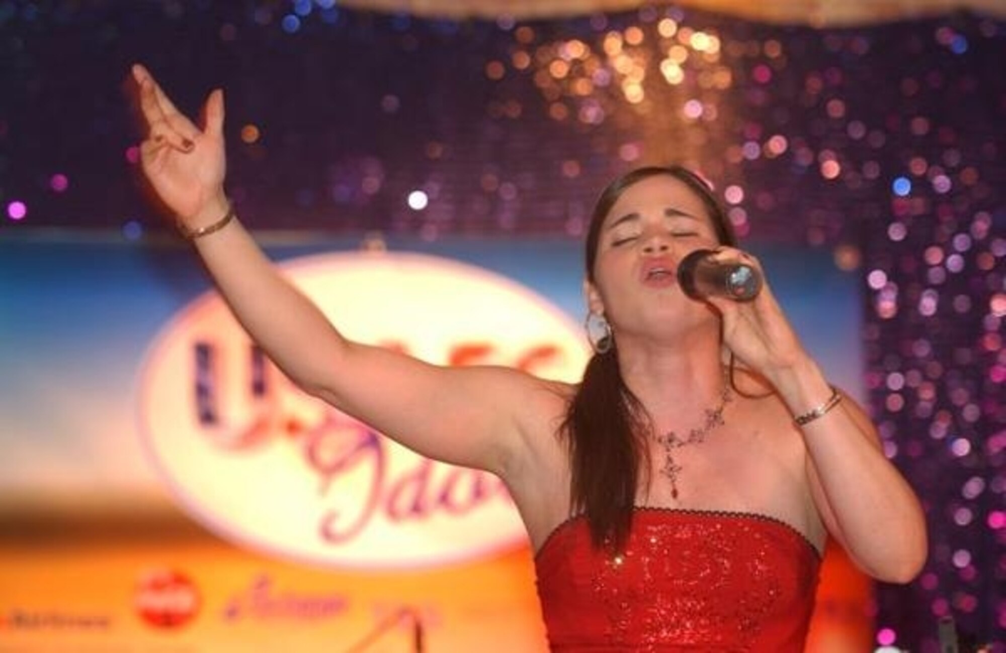 RAMSTEIN AIR BASE, Germany – Senior Airman Gina Bauza, 52nd Dental Squadron, performs at the U.S. Air Forces in Europe Idol contest. Airman Bauza will be leaving Spangdahlem Air Base in February to perform with the Tops in Blue team for a year. (Courtesy photo)
