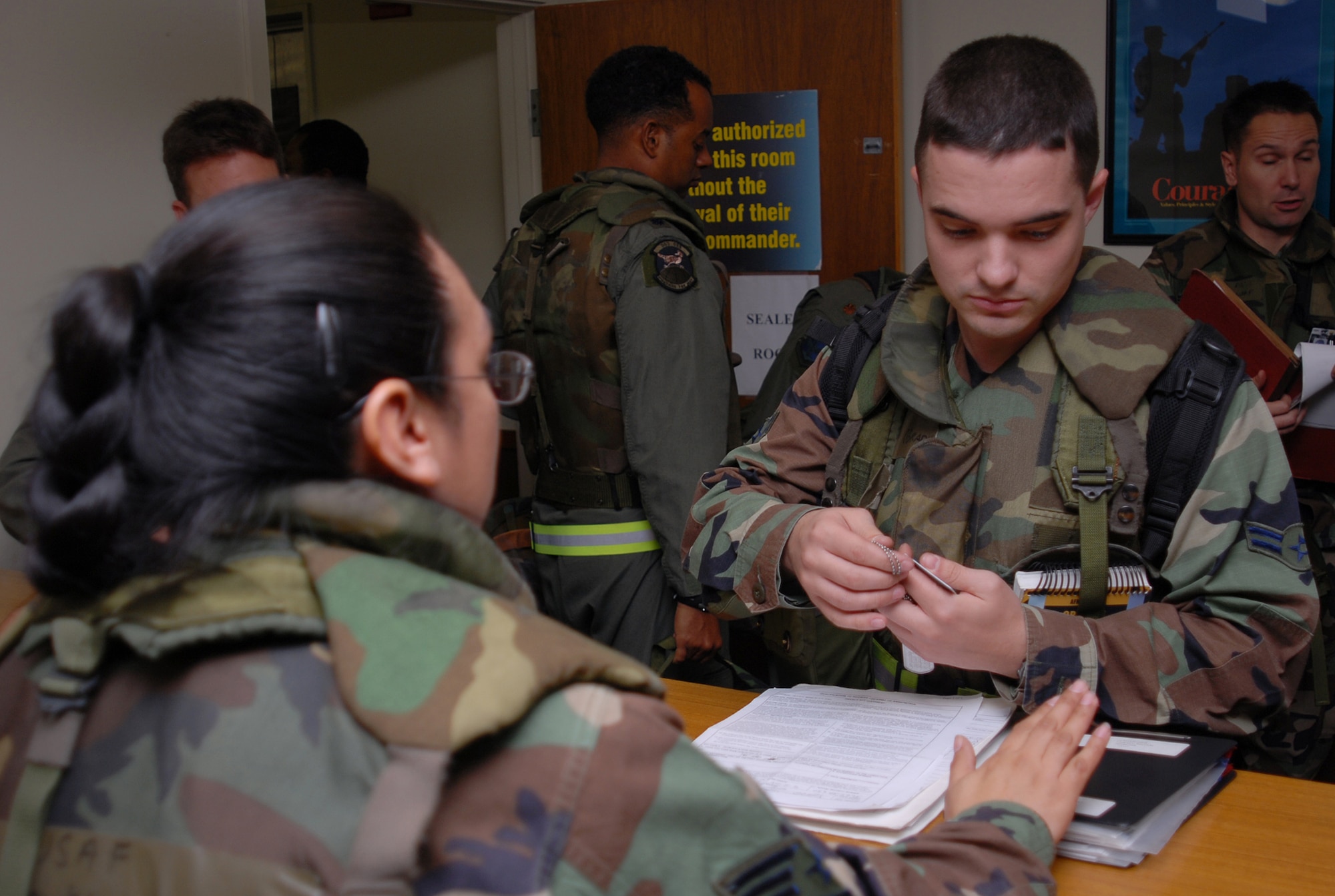 Airman 1st Class Brian O'Grady, 353rd Maintenance Squadron, processes through a deployment line during Local Operational Readiness Exercise Beverly High 08-3 at Kadena Air Base, Japan, Jan. 7, 2007. The 18th Wing exercise from Jan. 7 to 11 tests the wing's ability to respond in contingency situations. (U.S. Air Force photo/Tech. Sgt. Dave DeRemer)