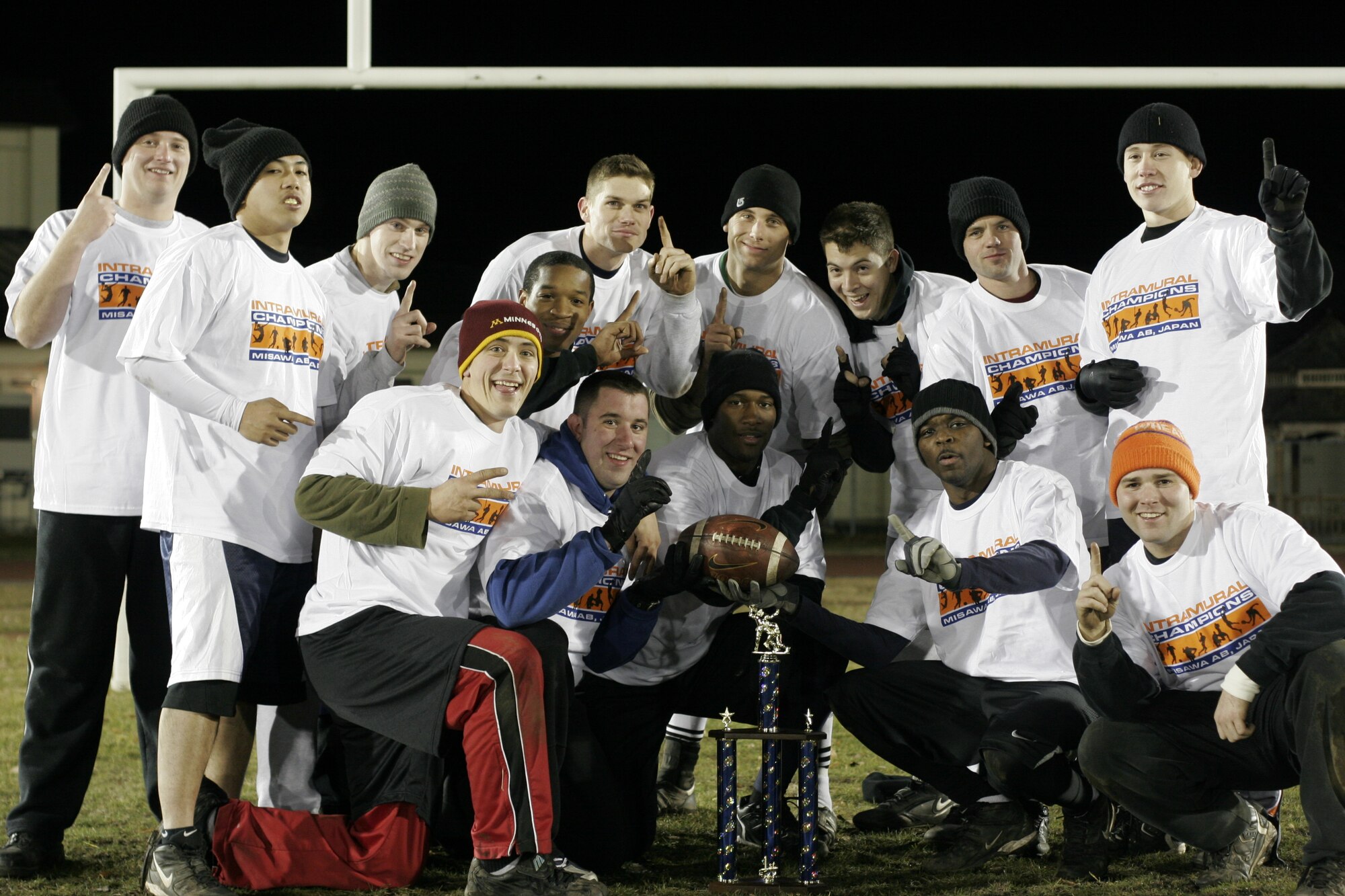 MISAWA AIR BASE, Japan -- The 35th Civil Engineer Squadron celebrates being the 2007 Commanders Cup Champions (Large Unit) in flag football. the 35th Services Squadron is the small unit champion. Despite finishing the regular season in fourth place, the 35th CES was able to come out of the losers bracket and win twice in the finals, claiming the championship. There will be a varsity football coaches meeting Jan. 26 from 9 a.m. to 10:30 a.m. at the enlisted club. Varsity football tryouts are scheduled from 9 a.m. to 12 p.m. Feb. 23 at the Potter Fitness Center. (Photo by Hiroki Hayashi)
