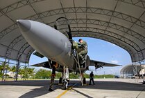 Maj. James “Saw” Sage gets down from his F-15A Eagle Jan 9. at Hickam Air Force Base, Hawaii after flying a training mission for currency. Maj. Sage is from the 199th Fighter Squadron, 154th Wing, Hawaii Air National Guard. The 199th has not flown since the Air Force grounded their F-15 fleet Nov. 3, 2007. Air Combat Command cleared a portion of its F-15 A-D models to begin flying today. (U.S. Air Force photo/ Tech. Sgt. Shane A. Cuomo)