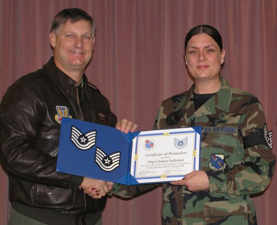 Newly promoted Tech. Sgt. Chelsea Iudiciani, an Airmen Leadership School instructor, receives her official promotion from the 99th Air Base Wing commander, Col. Michael Bartley, as part of the Air Force’s Stripes for Exceptional Performer promotion program. (U.S. Air Force photo by Master Sgt. Kristin Daugherty)