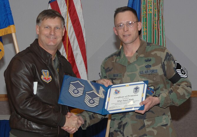 Newly promoted Master Sgt. James H. Ruth, a 99th Civil Engineer Squadron explosive ordinance disposal operator, receives his official promotion from the 99th Air Base Wing commander, Col. Michael Bartley, as part of the Air Force’s Stripes for Exceptional Performer promotion program. (U.S. Air Force photo by Staff Sgt. Scottie McCord)