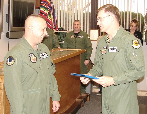 Newly promoted Master Sgt. David Potter, the 34th Weapons Squadron operations superintendent, receives his official promotion from the 57th Wing commander, Brig. Gen. Stephen Hoog, as part of the Air Force’s Stripes for Exceptional Performer promotion program. (Courtesy photo from 57th Command Chief’s Office)
