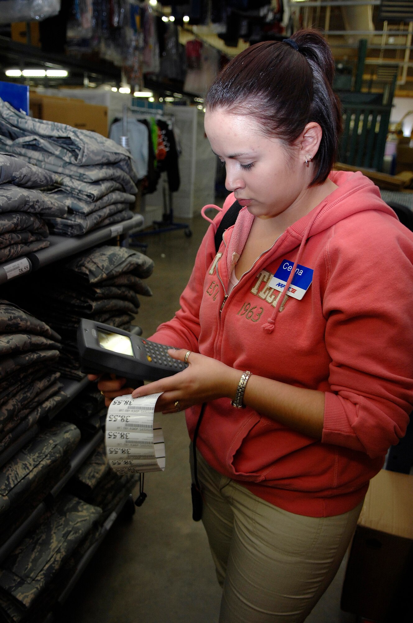 Celina Alamos, a worker for the Army and Air Force Exchange Service (AAFES) and wife of Airman 1st Class Jancey Alamos, from the 28th Security Forces Squadron, prints out price labels for shelves stocked with new Airman Battle Uniforms (ABU) at Ellsworth Air Force Base, S.D., Jan. 09, 2008.  The ABU will be available for purchase to the general base population for the first time starting Friday at 9 A.M., for more information contact AAFES at 923-4774.  (U.S. Air Force photo/Staff Sgt. Michael B. Keller)