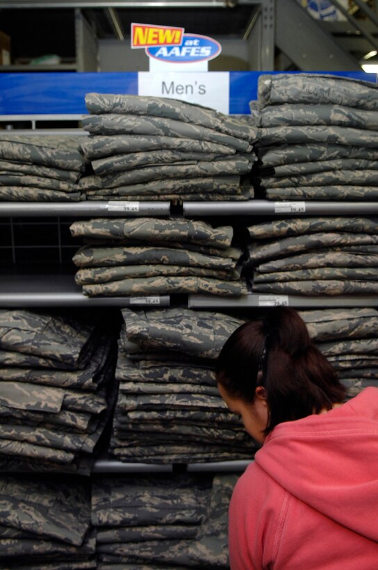 Celina Alamos, a worker for the Army and Air Force Exchange Service (AAFES) and wife of Airman 1st Class Jancey Alamos, from the 28th Security Forces Squadron, stocks shelves with new Airman Battle Uniforms (ABU) at Ellsworth Air Force Base, S.D., Jan. 09, 2008.  The ABU will be available for purchase to the general base population for the first time starting Friday at 9 A.M., for more information contact AAFES at 923-4774.  (U.S. Air Force photo/Staff Sgt. Michael B. Keller)