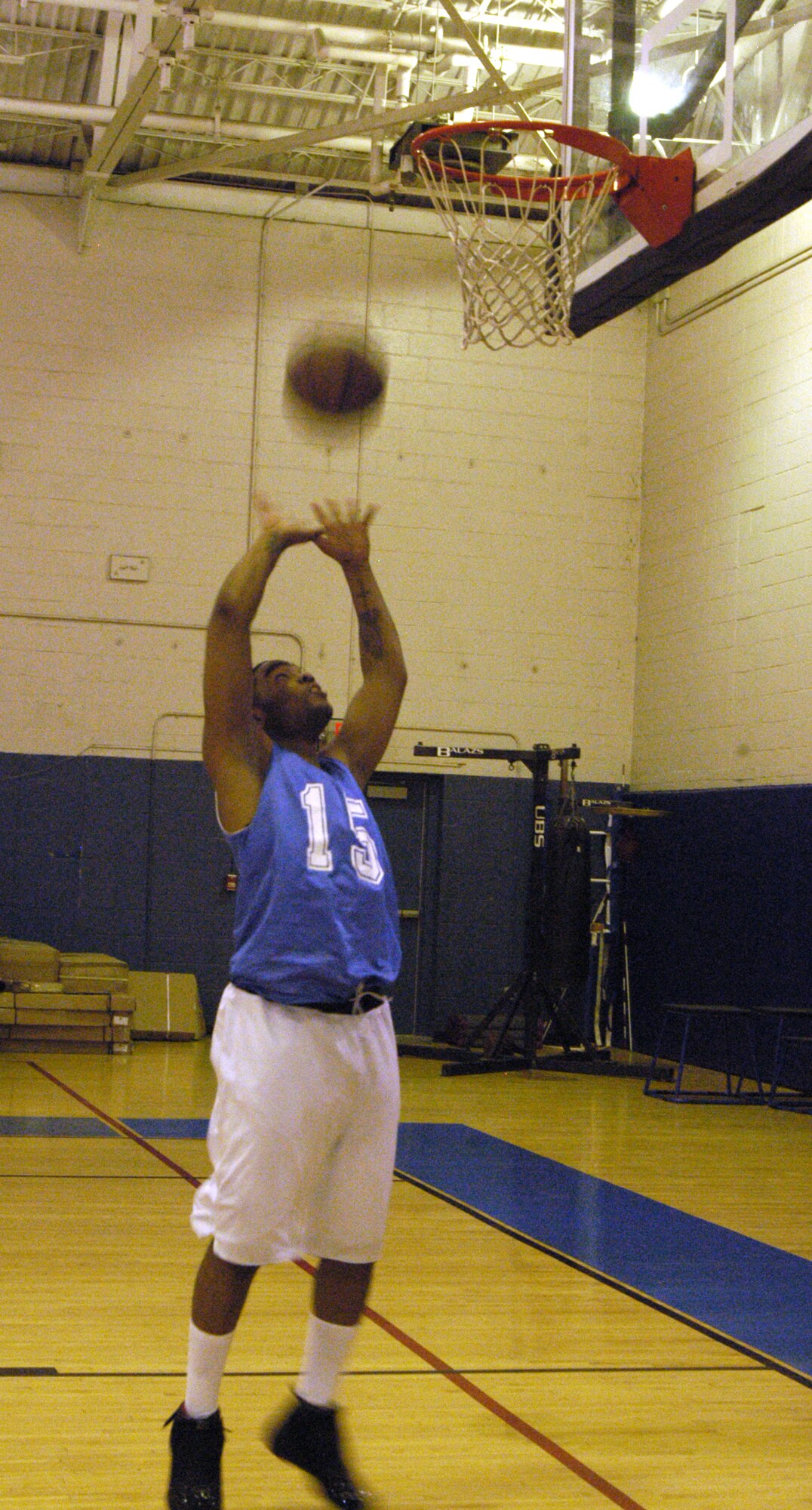 Granville Bazemore, 436th Security Foces Squadron, makes an uncontested two-point field goal during the 436th SFS vs. 436th Medical Group intramural basketball game Jan. 7 here. The Medics beat the Cops 43-26. (U.S. Air Force photo/Airman Shen-Chia Chu)