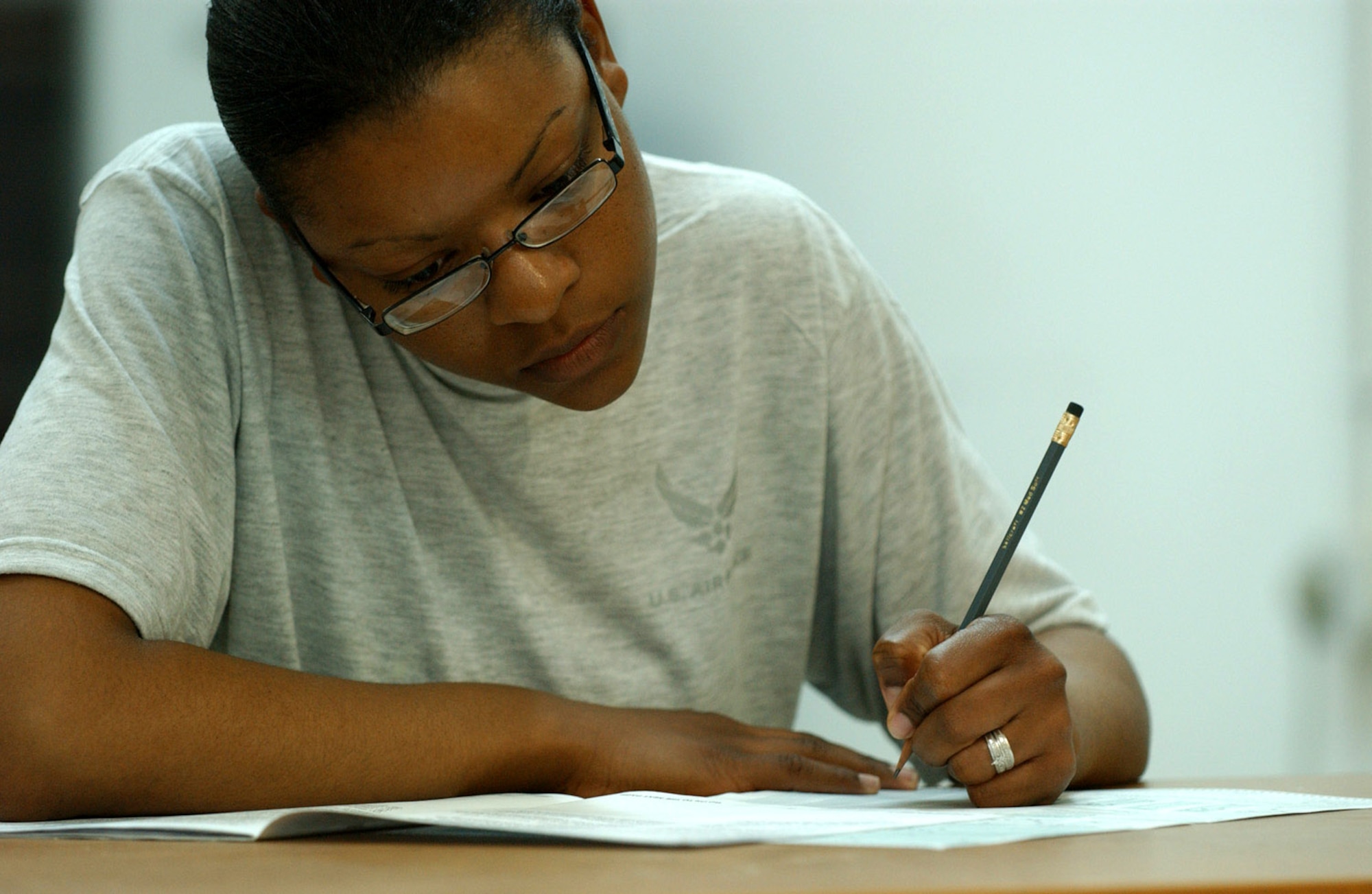 Senior Airman Jaquetta Bice concentrates while taking a College Level Entrance Exam Program test Jan. 3 at Ali Base, Iraq. The 407th Expeditionary Services Squadron Education Center gives servicemembers the opportunity to further their education and career development. Airman Bice is assigned to the 407th Expeditionary Security Forces Squadron and is deployed from Seymour Johnson Air Force Base, N.C. (U.S. Air Force photo/Airman 1st Class Jonathan Snyder) 
